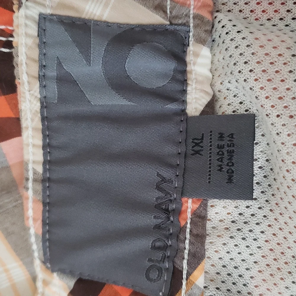 Old Navy plaid swim shorts tan, orange, brown. Pockets, built in brief. Size XXL